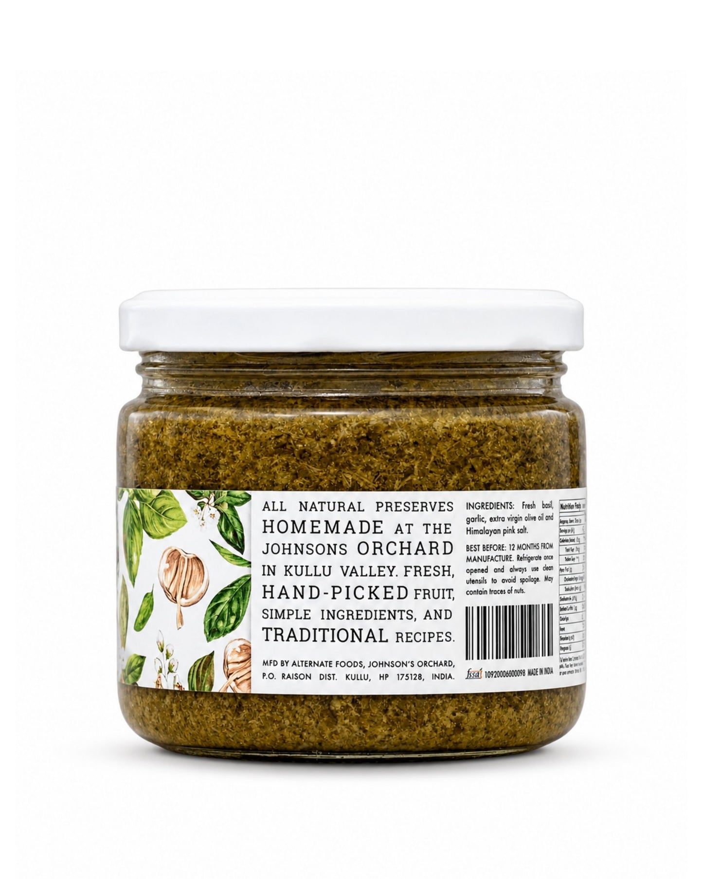 A jar of Big Bear Farms fresh basil in a bottle from Johnson's Orchard, featuring a white lid and a white label with green illustrations of citrus peels and leaves, set against a plain white background.