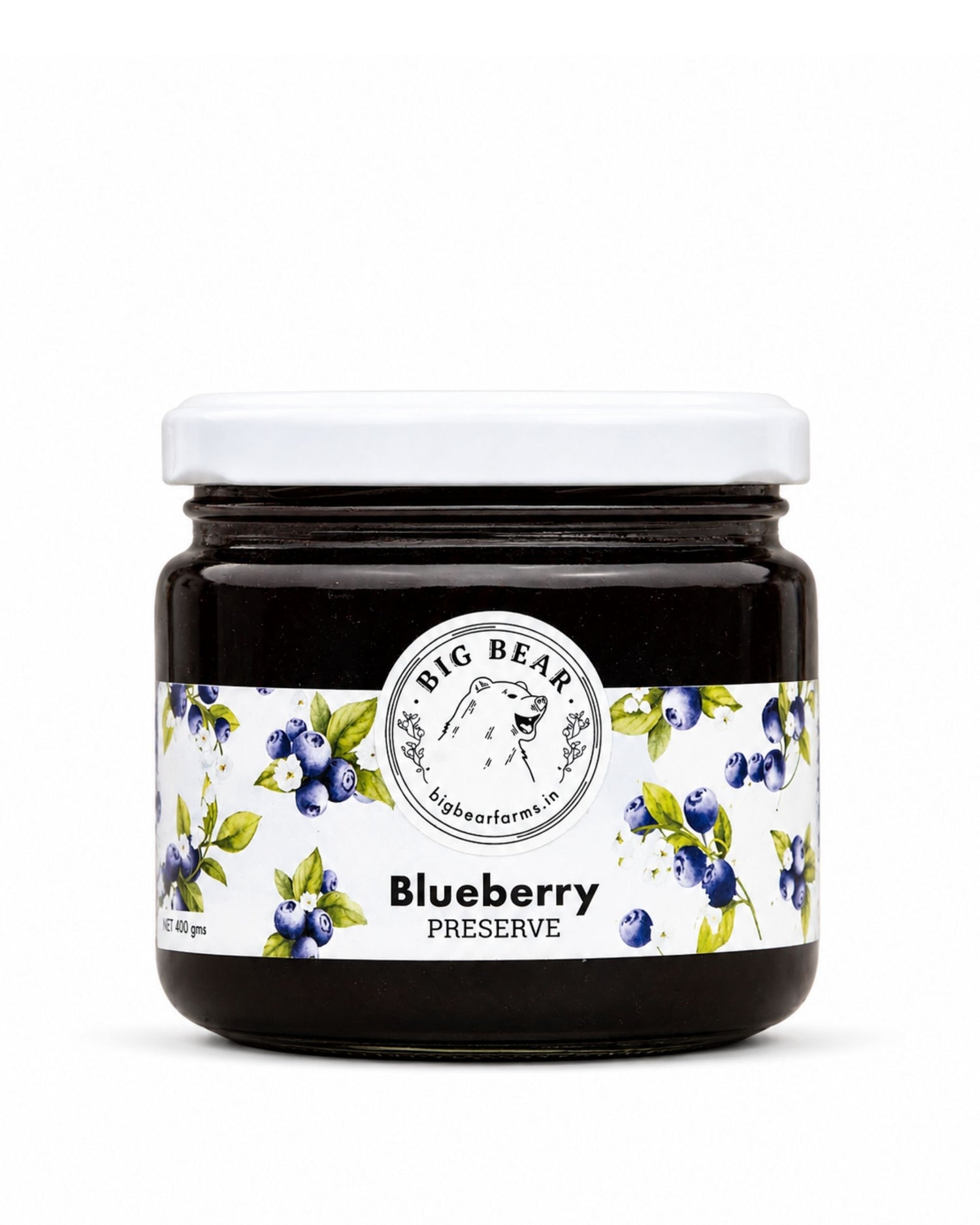 A jar of Big Bear Farms Blueberry Preserve with a white lid and a white label decorated with blueberries and green leaves, on a white background.