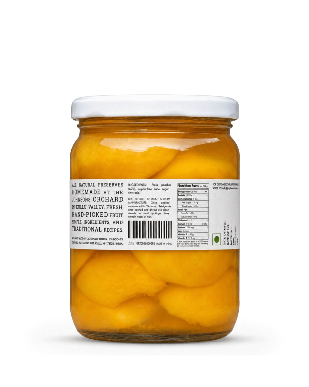 A glass jar of Big Bear Farms sliced peaches in syrup with a white lid and a white label showing product details.