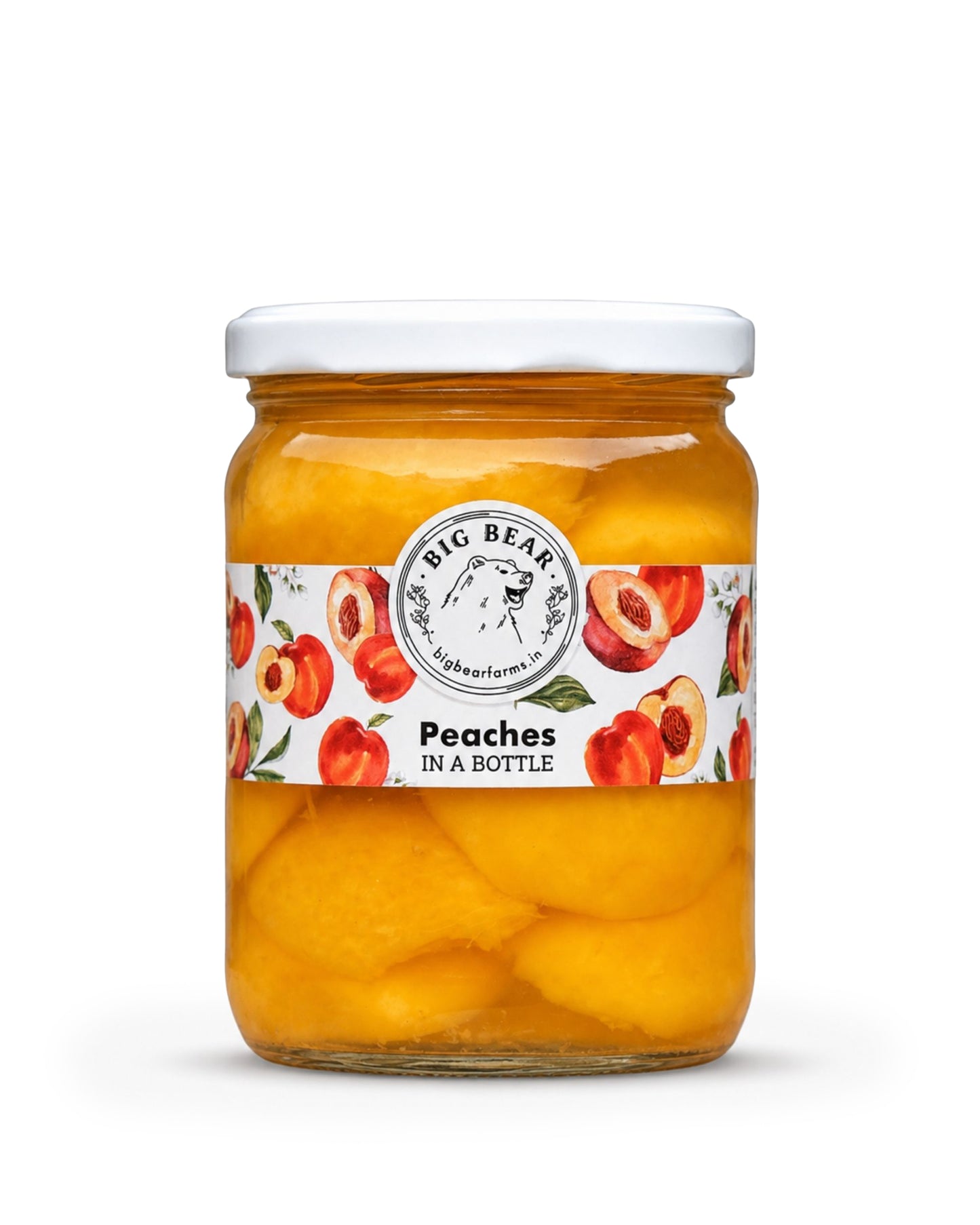 A glass jar of Big Bear Farms Peaches in a Bottle, featuring yellow-orange peaches submerged in syrup with a white lid and a white label decorated with red peaches.