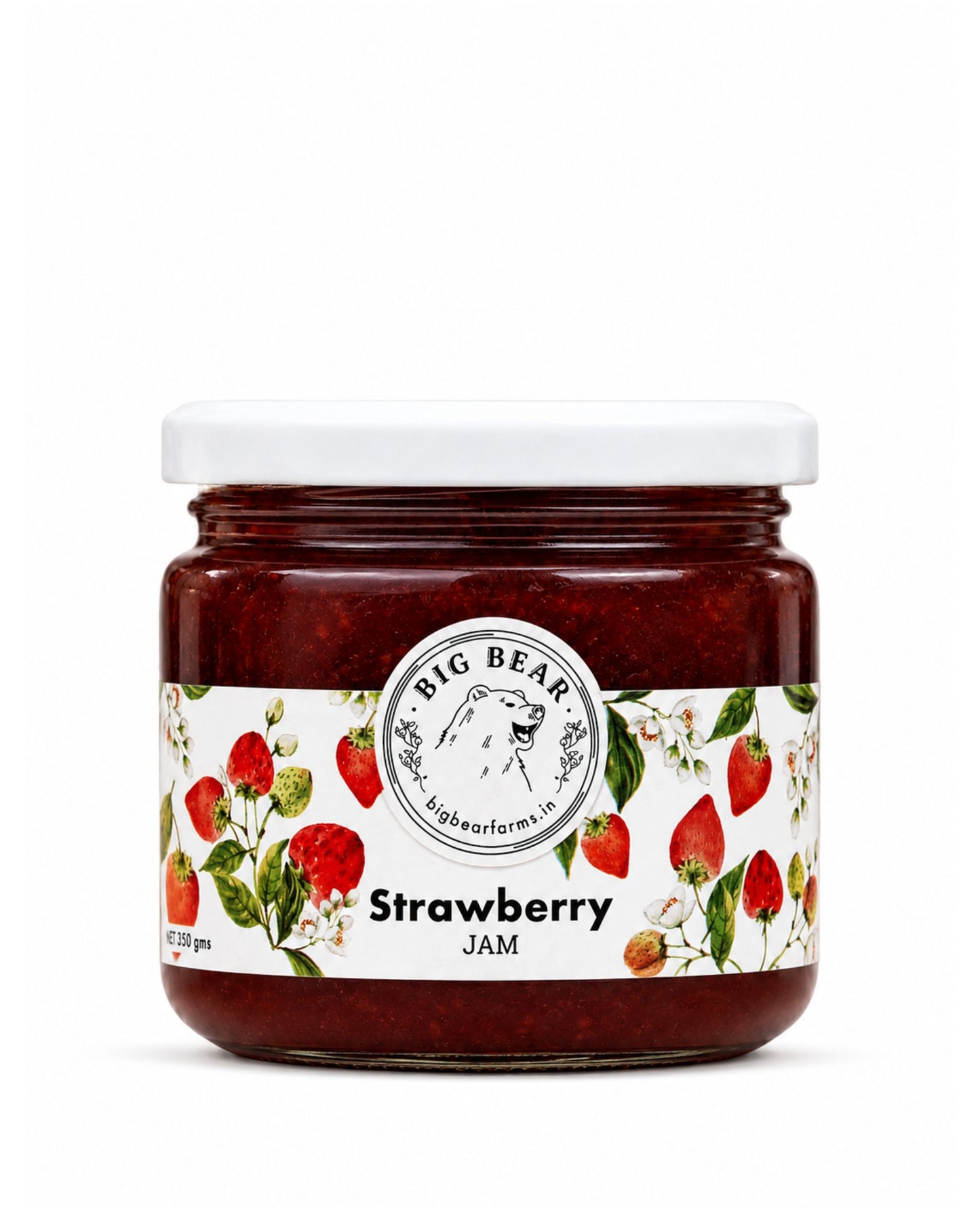 A glass jar of Big Bear Farms Strawberry Jam with a white lid and a white label decorated with illustrations of strawberries and green leaves, set against a plain white background.