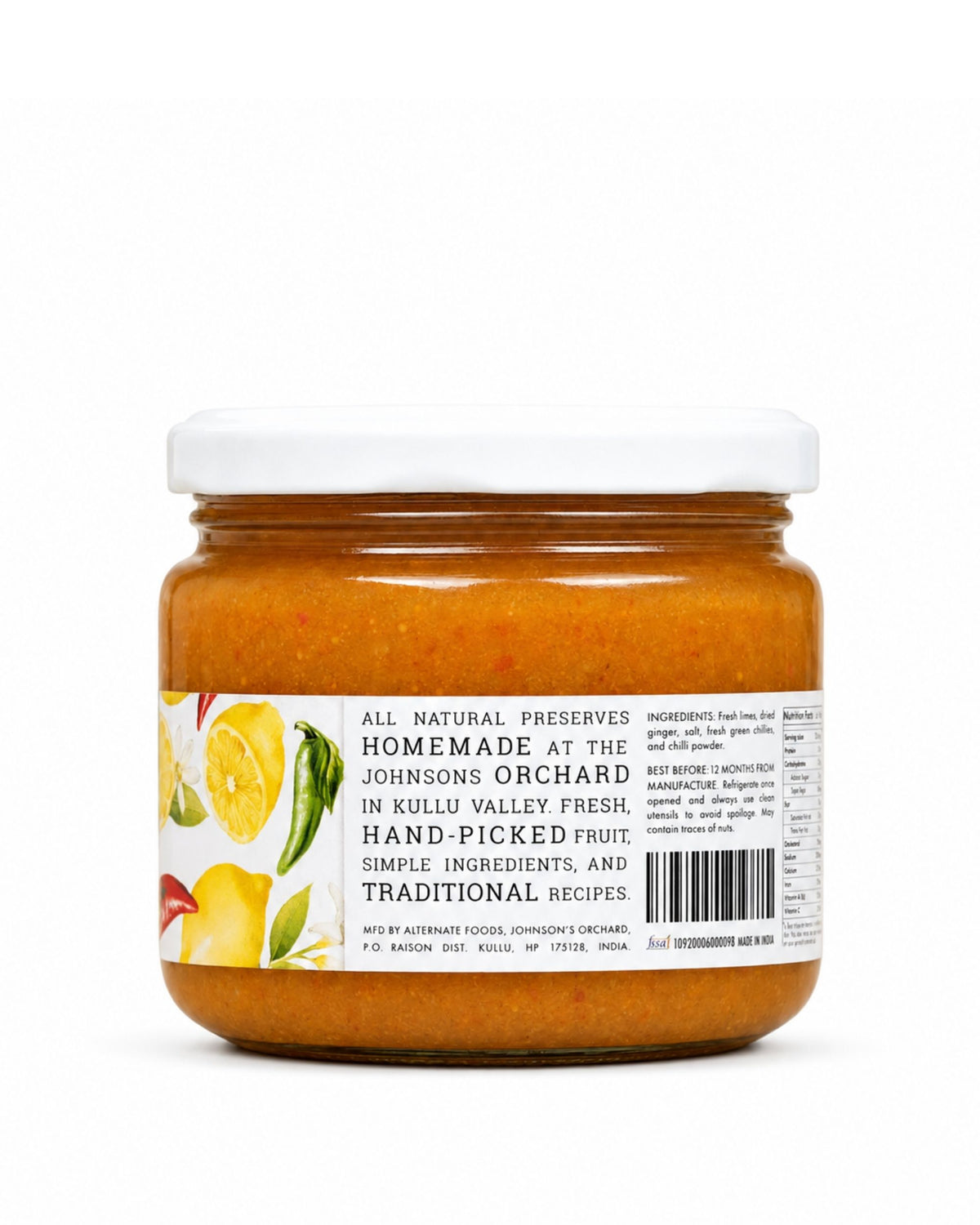 A glass jar of Big Bear Farms Homemade lemon pickle (nimbu achar) with a white lid and a white label featuring yellow and green fruit illustrations, set against a plain white background.